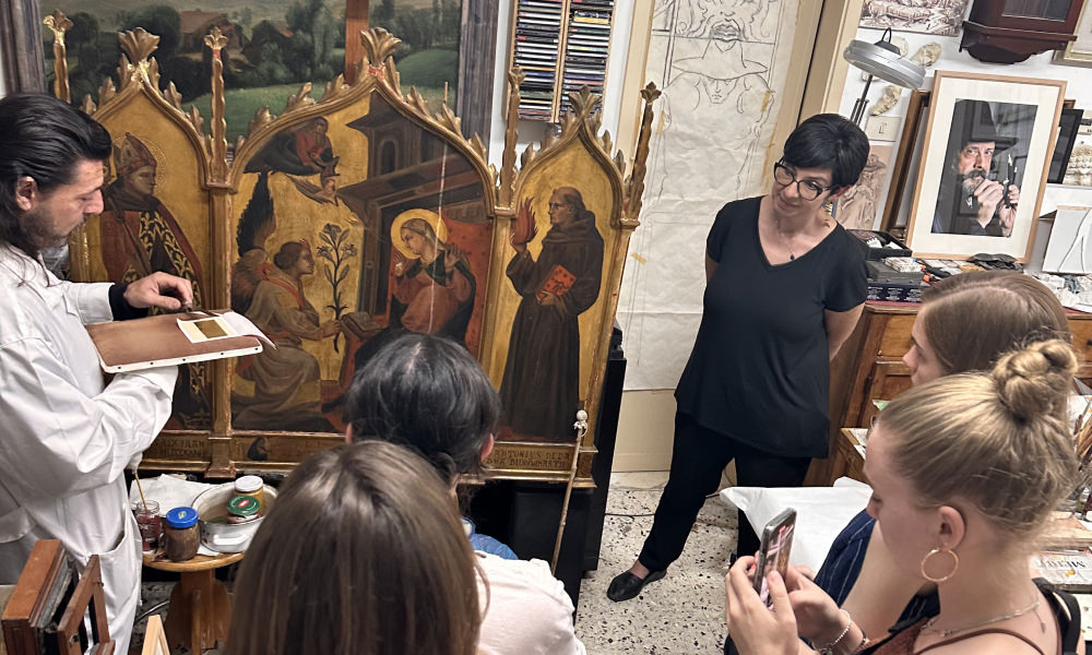 Students listening to a guided tour in Florence