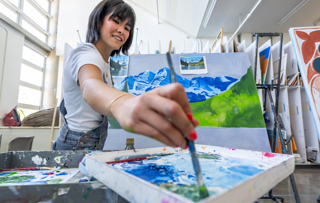 Female student painting in the art studio