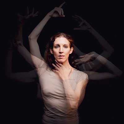 Multiple exposure photo of Gabrielle Lamb in multiple arm positions