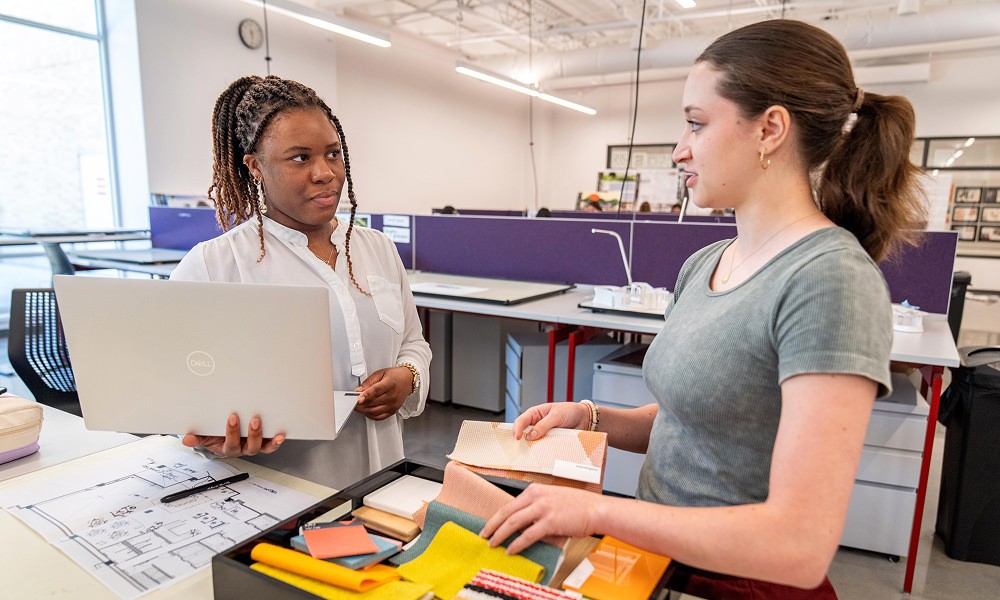 faculty and student of interior design in a classroom