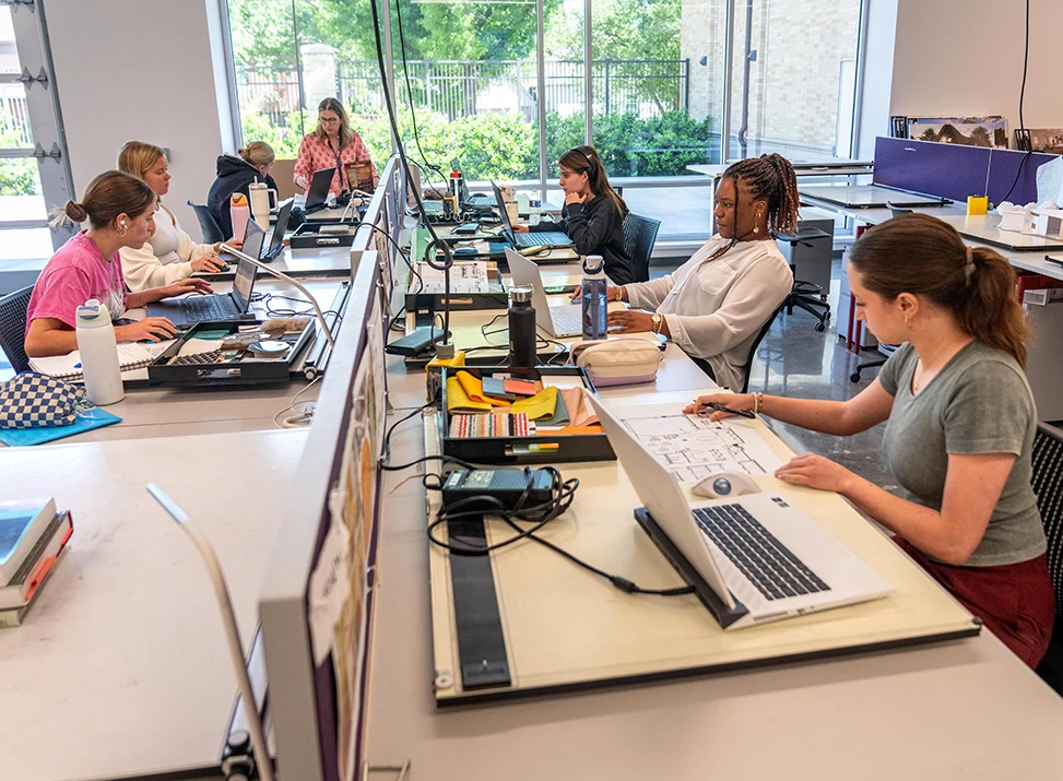 Students work in a computer lab within the Fine Arts Building
