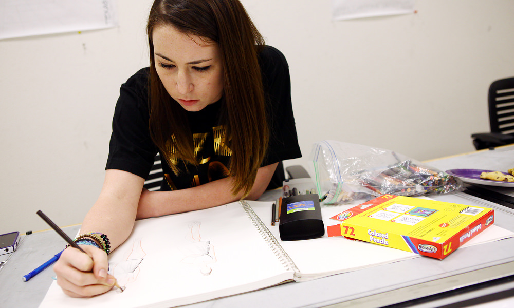 Fashion student sketching ideas