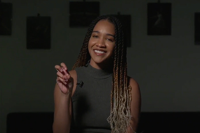 Kira Daniel makes the Go Frogs hand sign