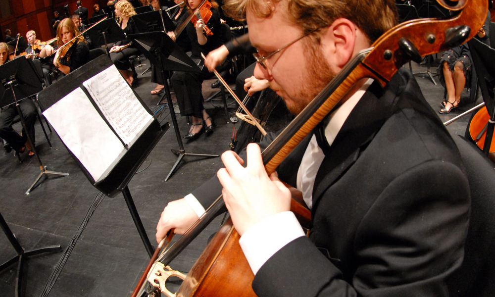 Studnet playing the double bass during a performance