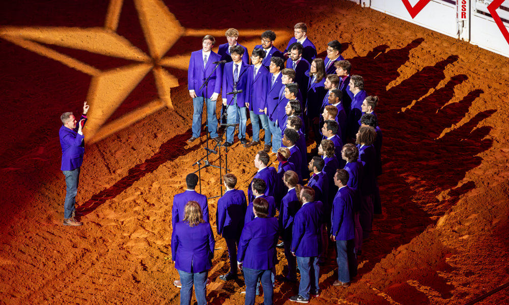 CU's male acapella vocal group Frog Corps sings the national anthem