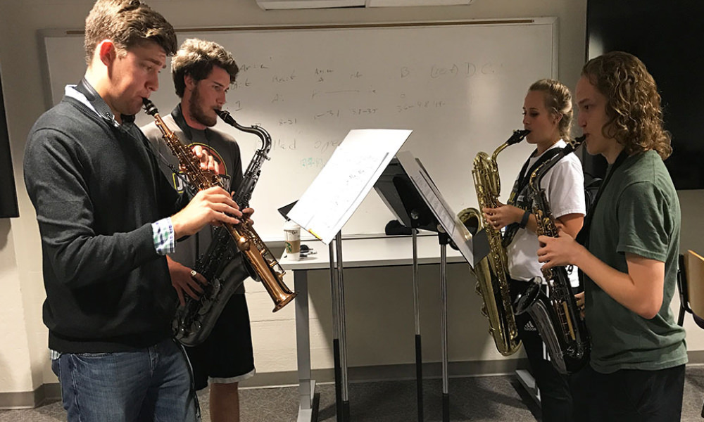 students practicing the saxophone